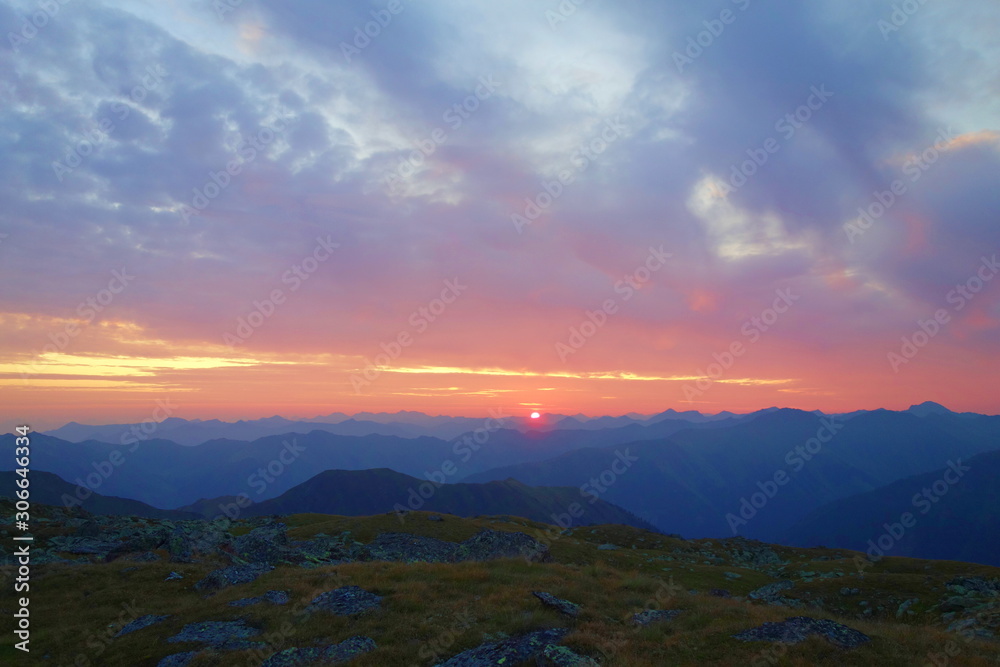 Majestic sunrise in Austrian Alps taken from Sölktal mountain with mountains in the background, Austria, Europe