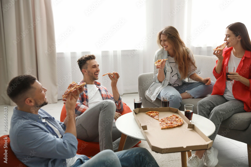 Group of friends eating tasty pizza at home Group of friends eating tasty pizza at home