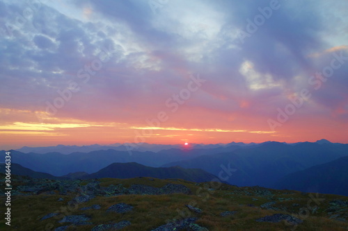 Majestic sunrise in Austrian Alps taken from Sölktal mountain with mountains in the background, Austria, Europe © Tom