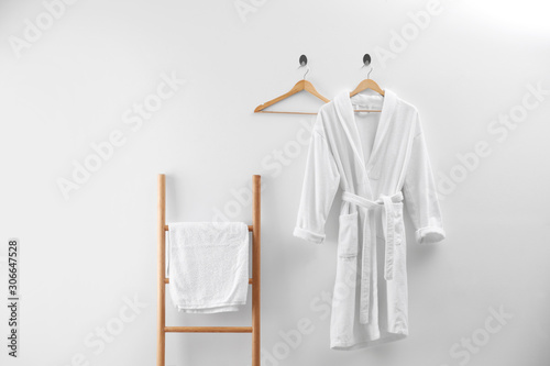 Soft comfortable bathrobe and fresh towel indoors photo