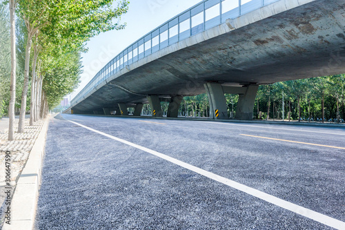 Blue sky overpass under the asphalt road, car advertising road material