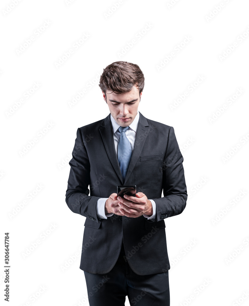 Serious businessman looking at phone, isolated Serious businessman looking at phone, isolated