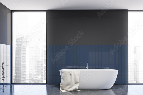 Gray and blue tile bathroom interior with tub