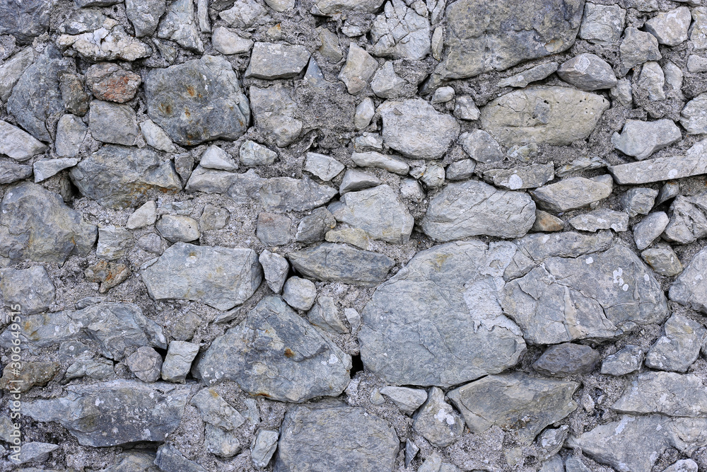 Fototapeta premium Old wall from stones of various shapes