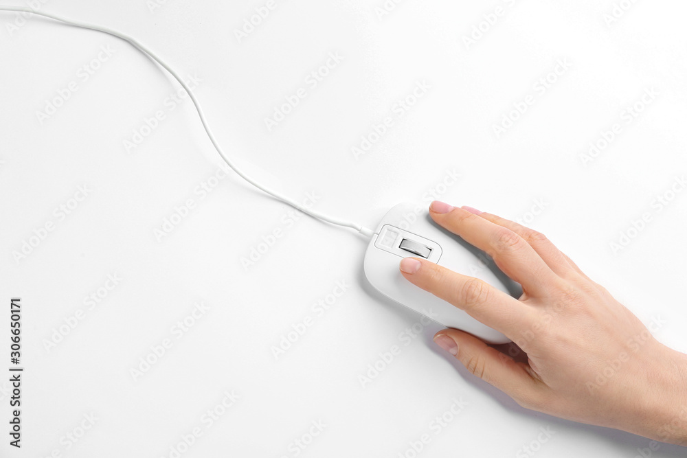 Woman using modern wired optical mouse on white background, top view Woman using modern wired optical mouse on white background, top view