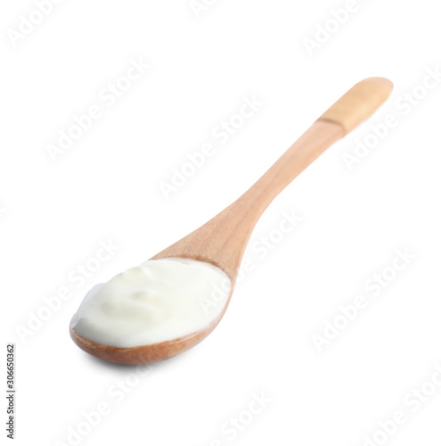 Wooden spoon with tasty organic yogurt isolated on white