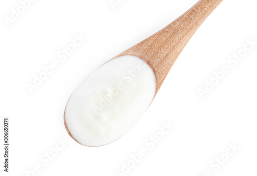 Wooden spoon with tasty organic yogurt isolated on white, top view