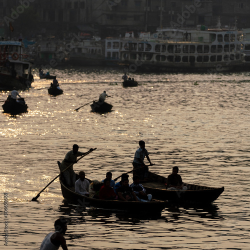 Silhouette of river boats at Sadar Ghat, Dhaka. photo