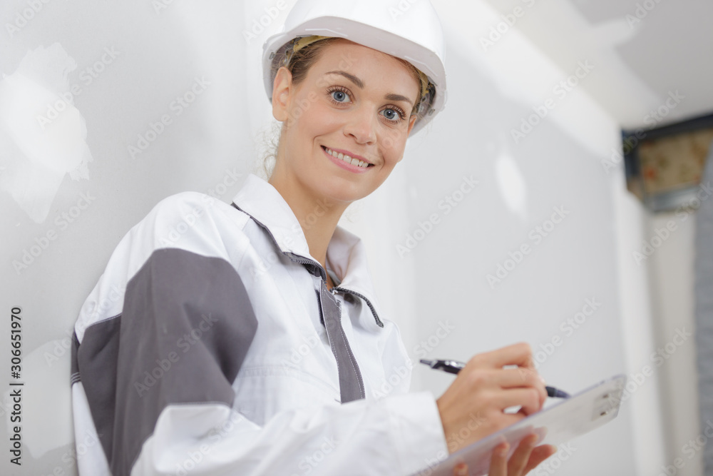 happy builder woman looking at camera happy builder woman looking at camera