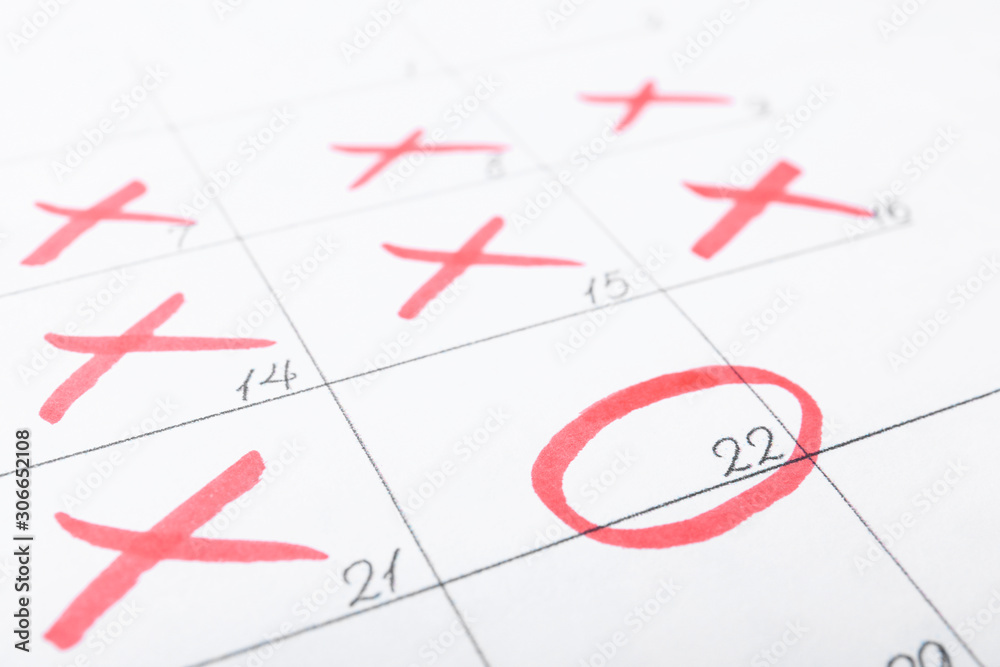 Calendar page with marked dates, closeup view Calendar page with marked dates, closeup view