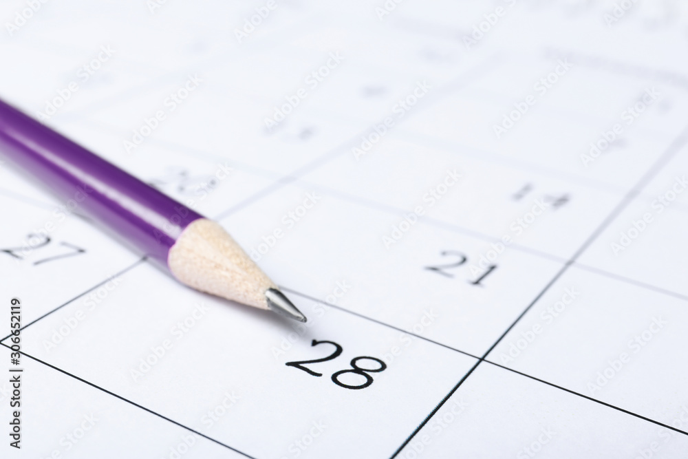 Pencil on calendar page, closeup. Planning concept Pencil on calendar page, closeup. Planning concept