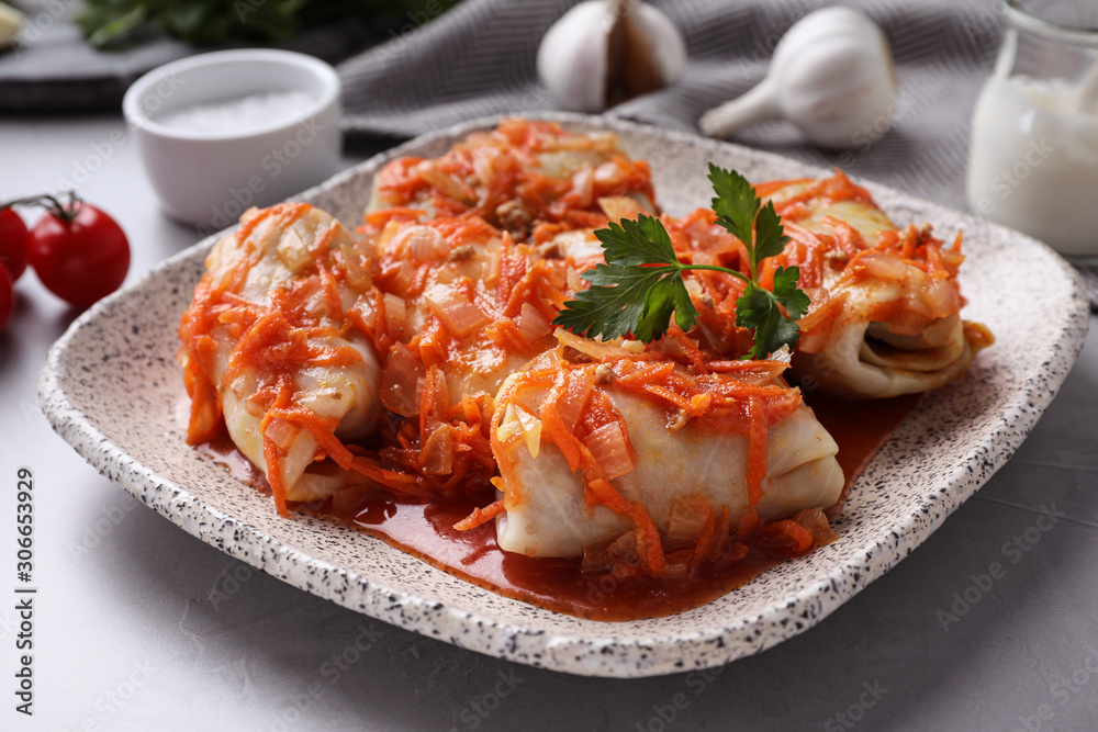 Delicious cabbage rolls served on grey table, closeup Delicious cabbage rolls served on grey table, closeup