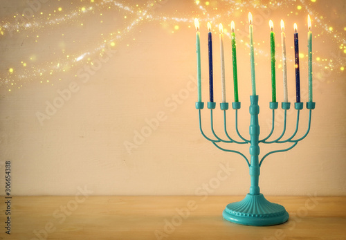 Religion image of jewish holiday Hanukkah background with menorah (traditional candelabra) and candles