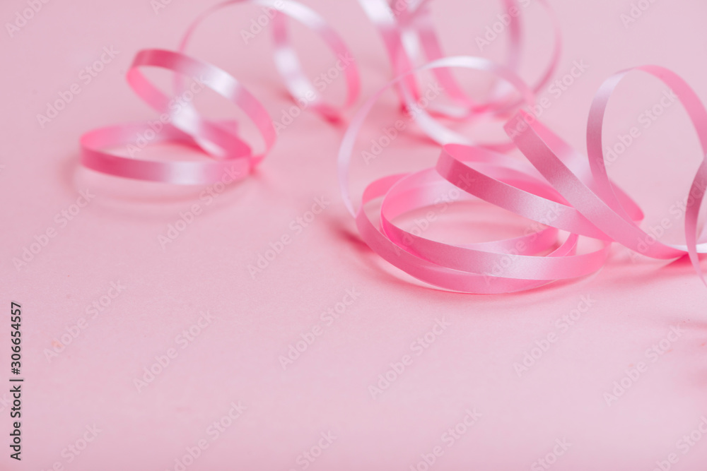 beautiful pink ribbon on bright background copy space