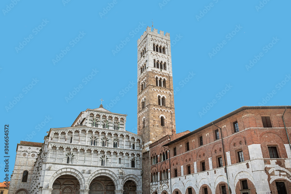 The beautiful frontage of Cathedral of San Martin with its tall bell tower, Lucca, Italy