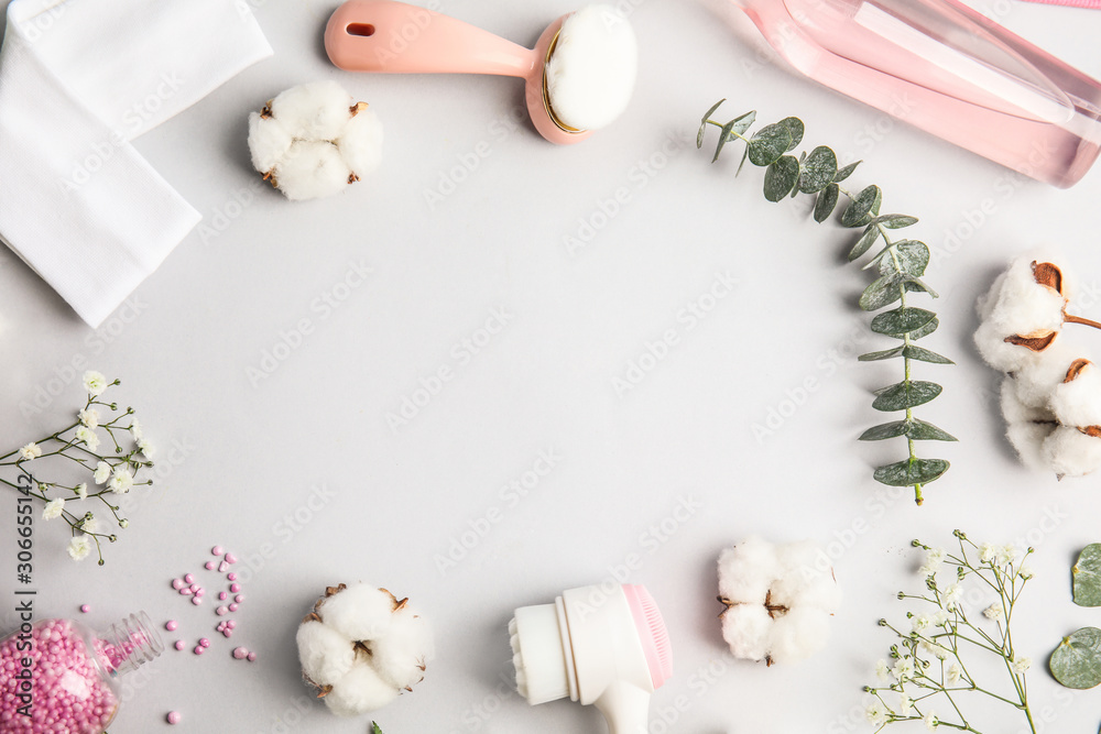 Flat lay composition with face cleansing brushes on light grey background. Cosmetic accessories Flat lay composition with face cleansing brushes on light grey background. Cosmetic accessories