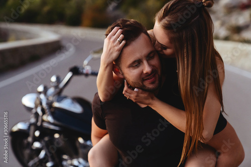 Couple of lovers kissing and hugging on motorbike - Two bikers stop in the countryside © Margo Basarab