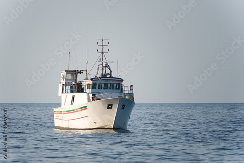 italian fishing boat on calm blue sea
