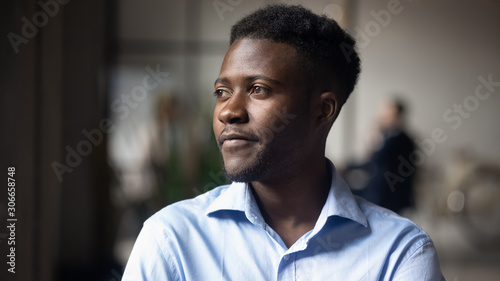 Φωτογραφία Head shot close up young thoughtful african american businessman.