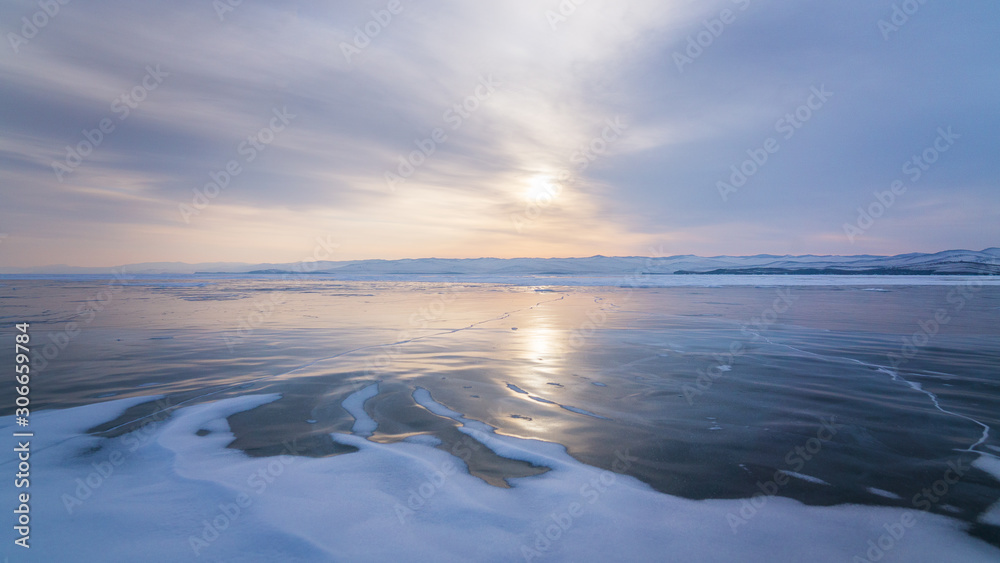 Sunrise over the frozen lake Baikal