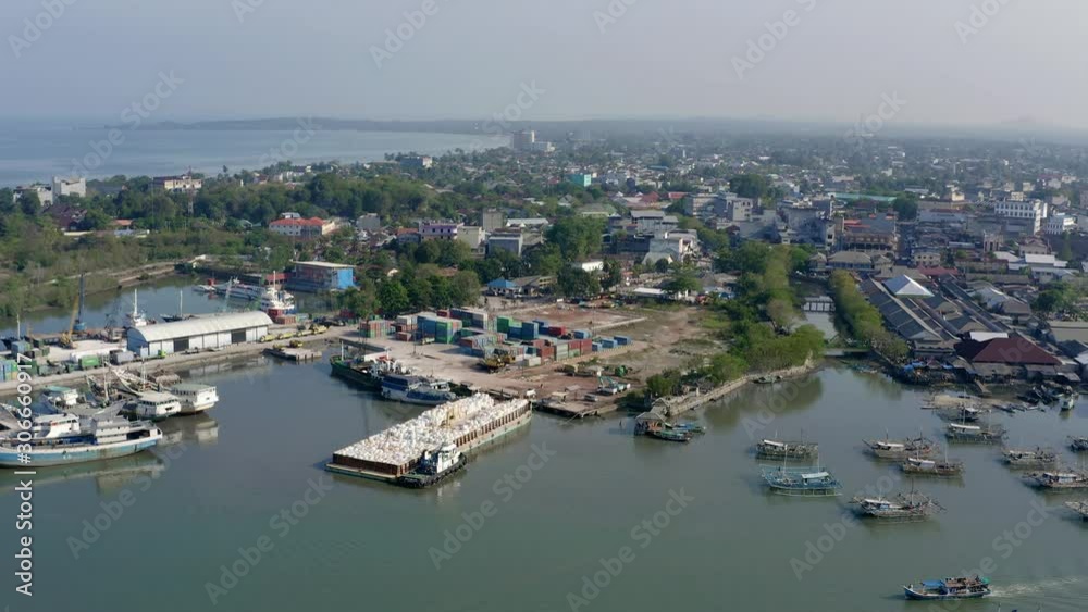 Aerial pan from left to right of Port Laskar on Belitung Island, Indonesia