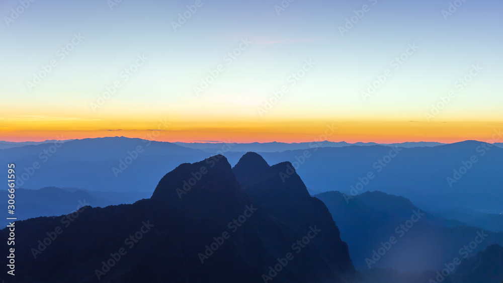 Panorama photo of sunset or evening time over mountain forest at Doi Luang Chiang Dao, Chaingmai, Thailand.