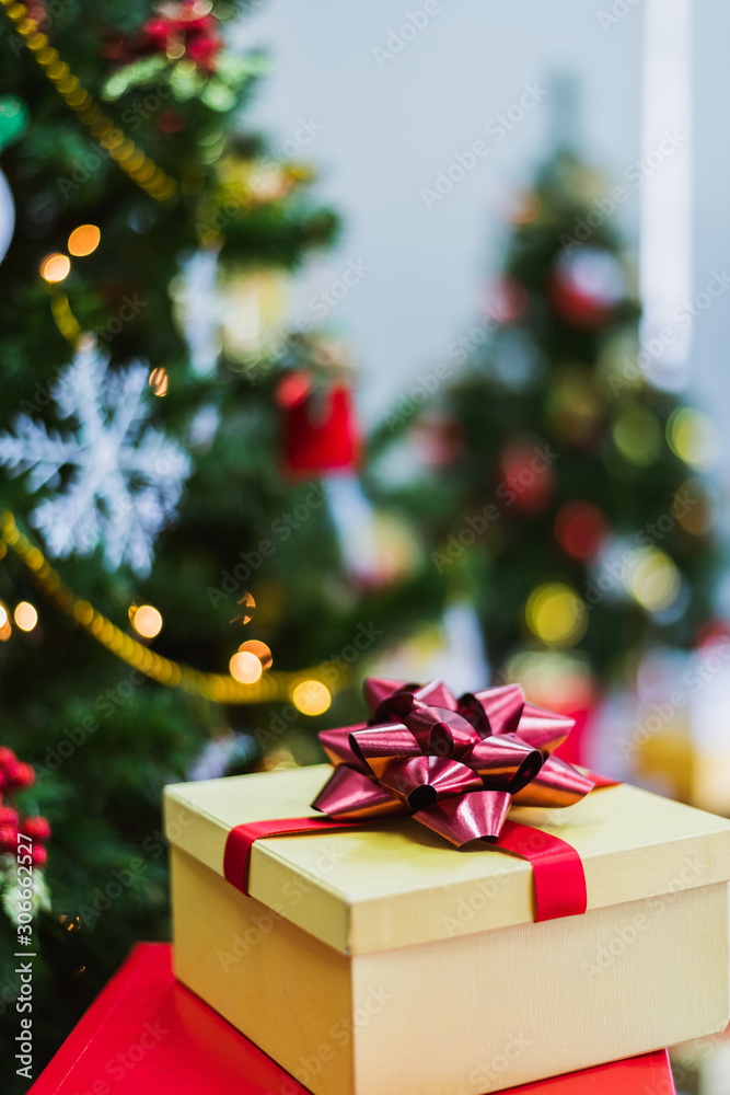 Christmas tree with gifts and decorations in living room