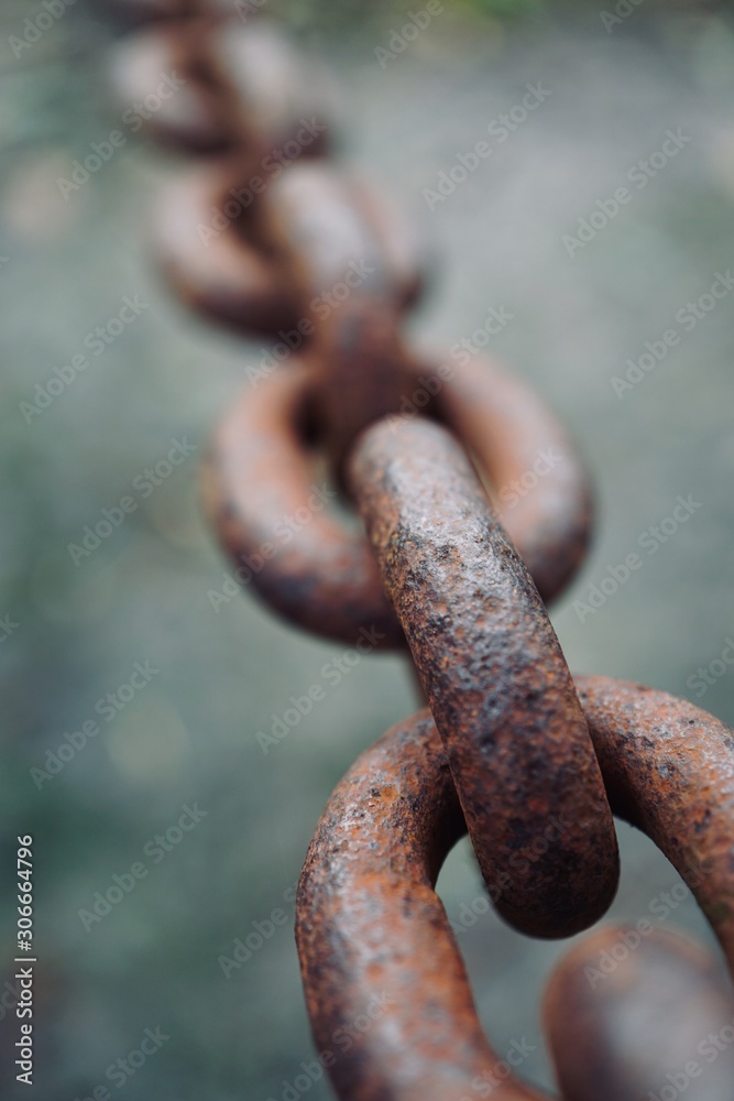 old metallic brown chain abandoned on the street old metallic brown chain abandoned on the street