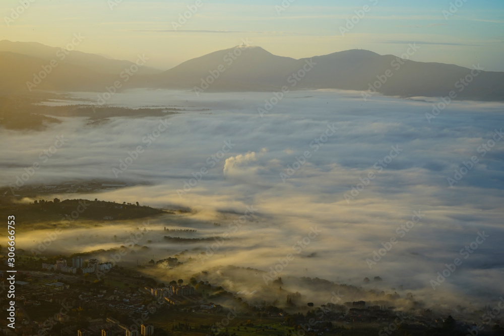 Fog and pollution from a mountain view at the sunrise