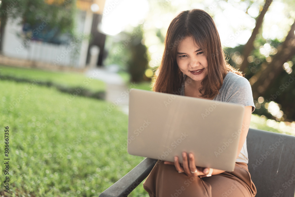 Asian freelance girl working with a laptop. Asian freelance girl working with a laptop.
