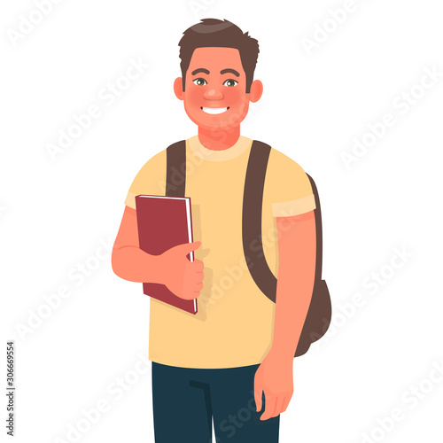 Smiling guy is a college student. A young male university undergraduate holds books in his hand