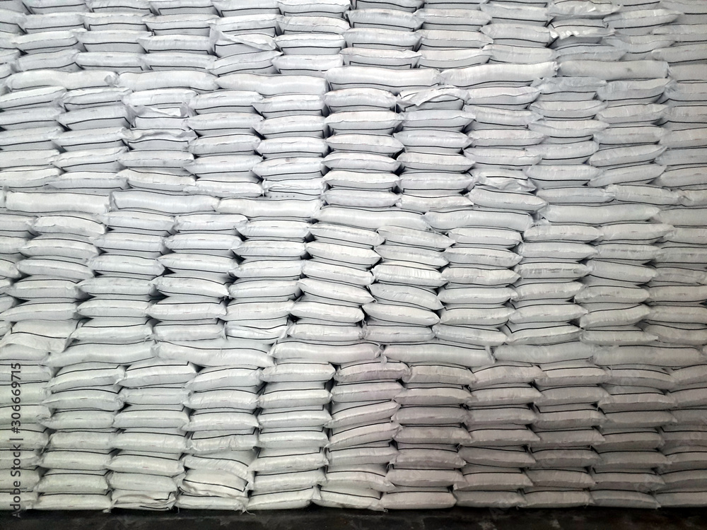 Fototapeta premium Chemical fertilizer urea The product stock is packed in sacks, stacked in the warehouse, waiting for delivery.