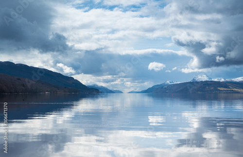 Fototapeta Naklejka Na Ścianę i Meble -  A view across Loch Ness looking down the length of the lake, with dark clouds above, in Scotland, UK
