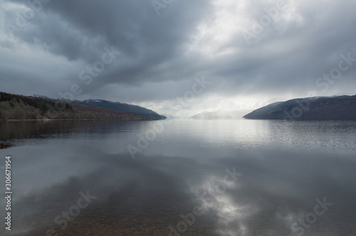 A view across Loch Ness looking down the length of the lake  with dark clouds above  in Scotland  UK