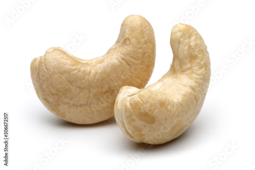 Two raw cashew nuts isolated on white