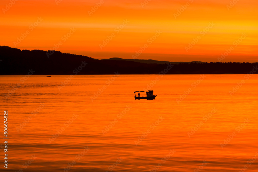 lonely boat and sunset lonely boat and sunset