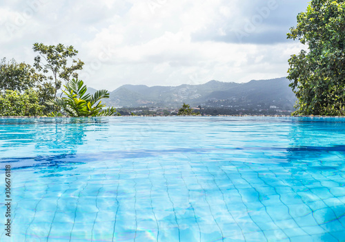 private luxury infinity pool looking out over at tropical nature view background