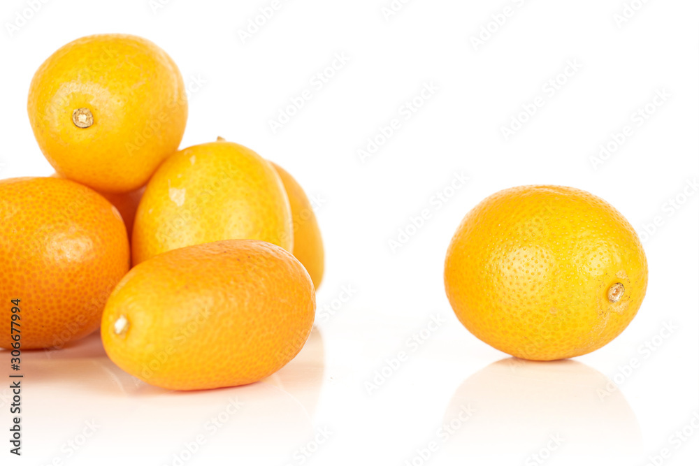 Group of six whole tasty orange kumquat isolated on white background Group of six whole tasty orange kumquat isolated on white background