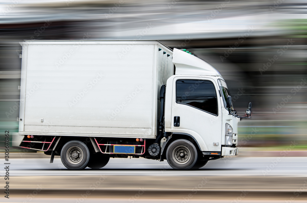 white truck running on the road with speed. white truck running on the road with speed.