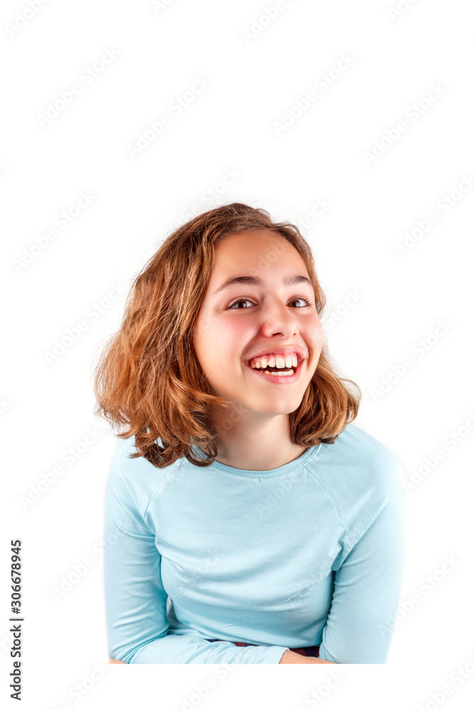 Pretty cute laughing teenager girl with curly hair isolated Pretty cute laughing teenager girl with curly hair isolated