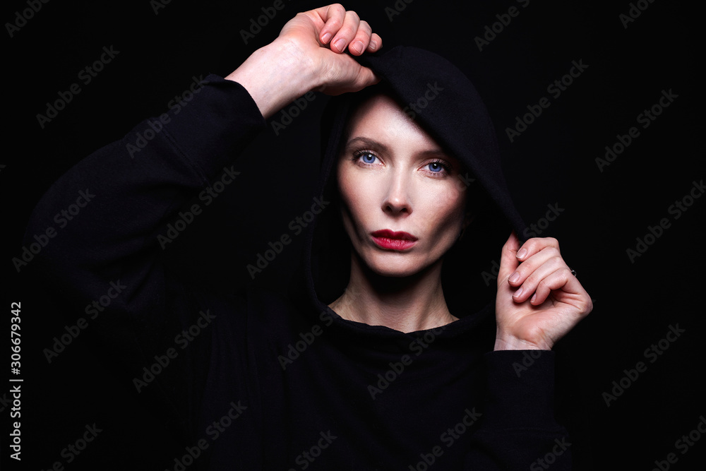 beautiful woman in hood. red lips and blue eyes beautiful woman in hood. red lips and blue eyes