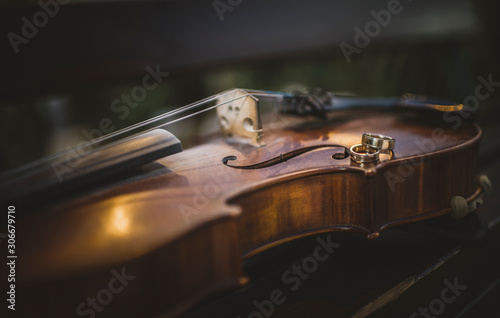 Wedding rings on a violin photo