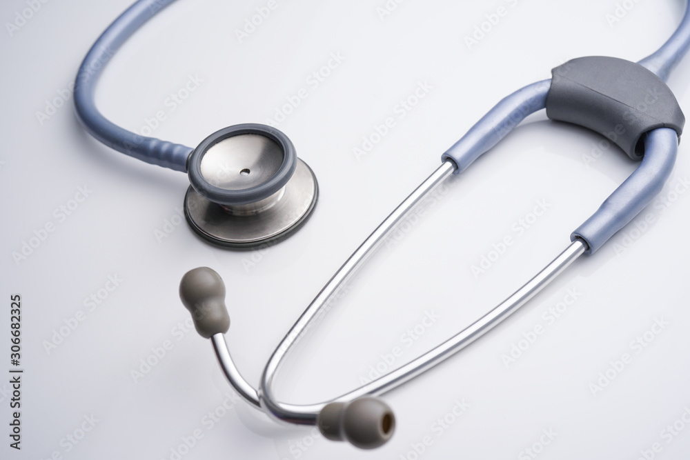 A medical stethoscope on white background A medical stethoscope on white background