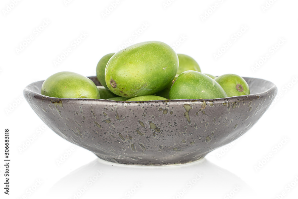 Lot of whole hardy green kiwi in glazed bowl isolated on white background Lot of whole hardy green kiwi in glazed bowl isolated on white background