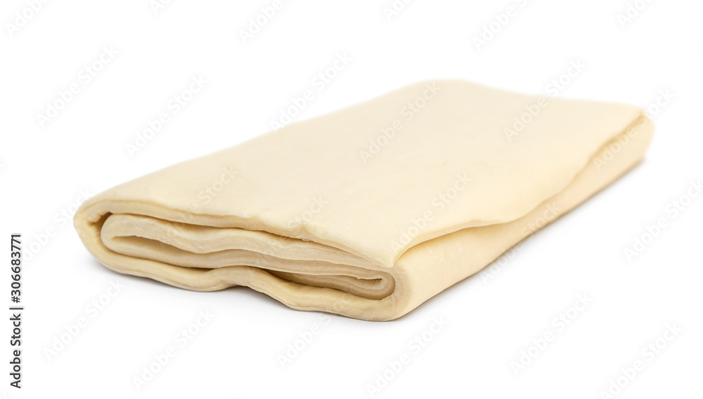Folded raw puff dough on white. Folded raw puff dough on white.