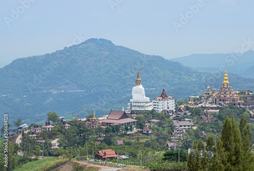 Landscape view public of big white Buddha statue at Wat Phra That Pha Son Kaew Temple with mountain view background at Khao Kho, Phetchabun ,Thailand.