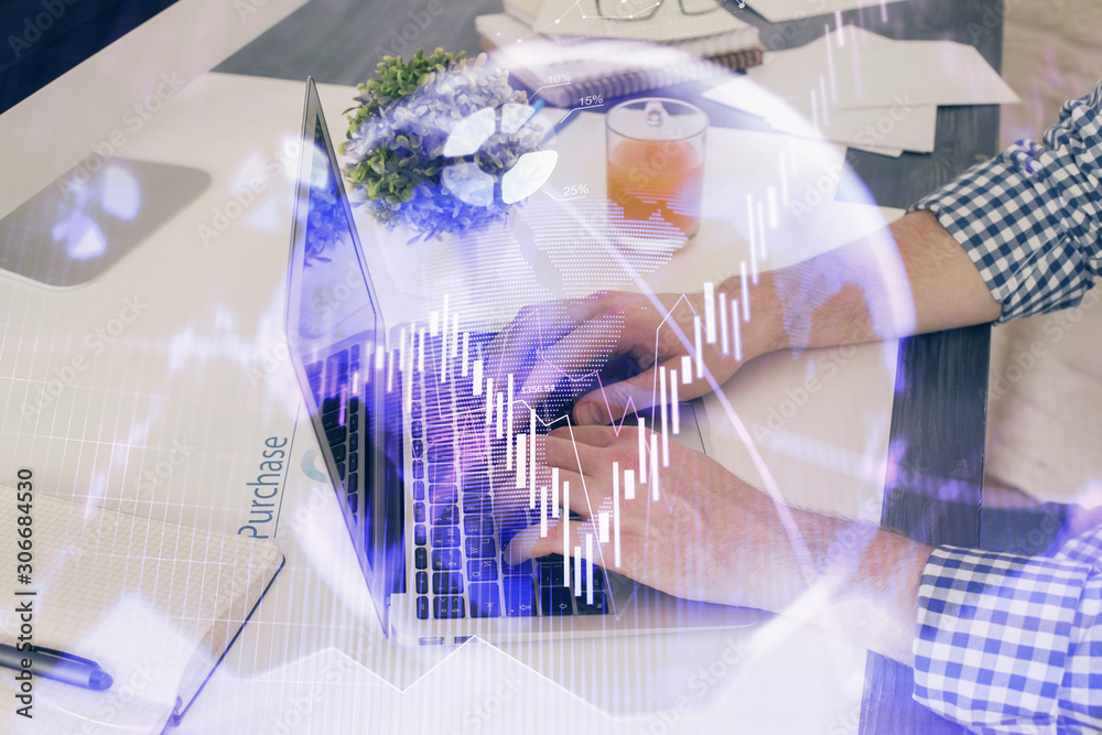 Multi exposure of graph with man typing on computer in office on background. Concept of hard work. Closeup. Multi exposure of graph with man typing on computer in office on background. Concept of hard work. Closeup.