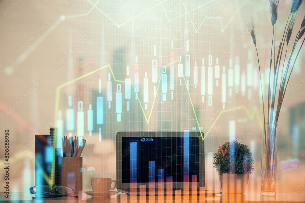 Stock market chart hologram drawn on personal computer background. Double exposure. Concept of investment. Stock market chart hologram drawn on personal computer background. Double exposure. Concept of investment.