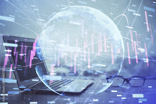 Stock market graph and table with computer background. Double exposure. Concept of financial analysis.