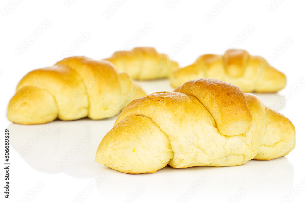 Group of four whole sweet golden mini croissant isolated on white background Group of four whole sweet golden mini croissant isolated on white background